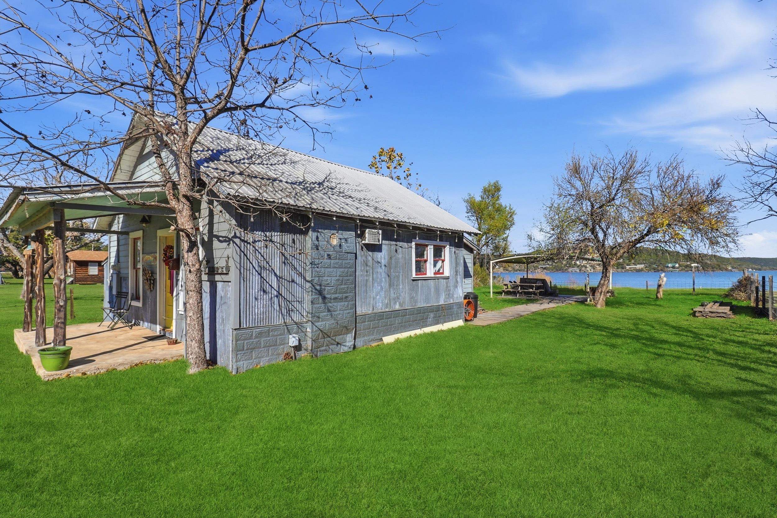 401 Lakeshore Loop Tow, TX 78672 - Photo 14 of 25 a view of a house with a backyard