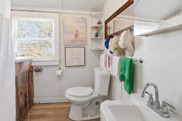 a living room with furniture a rug and a large window
