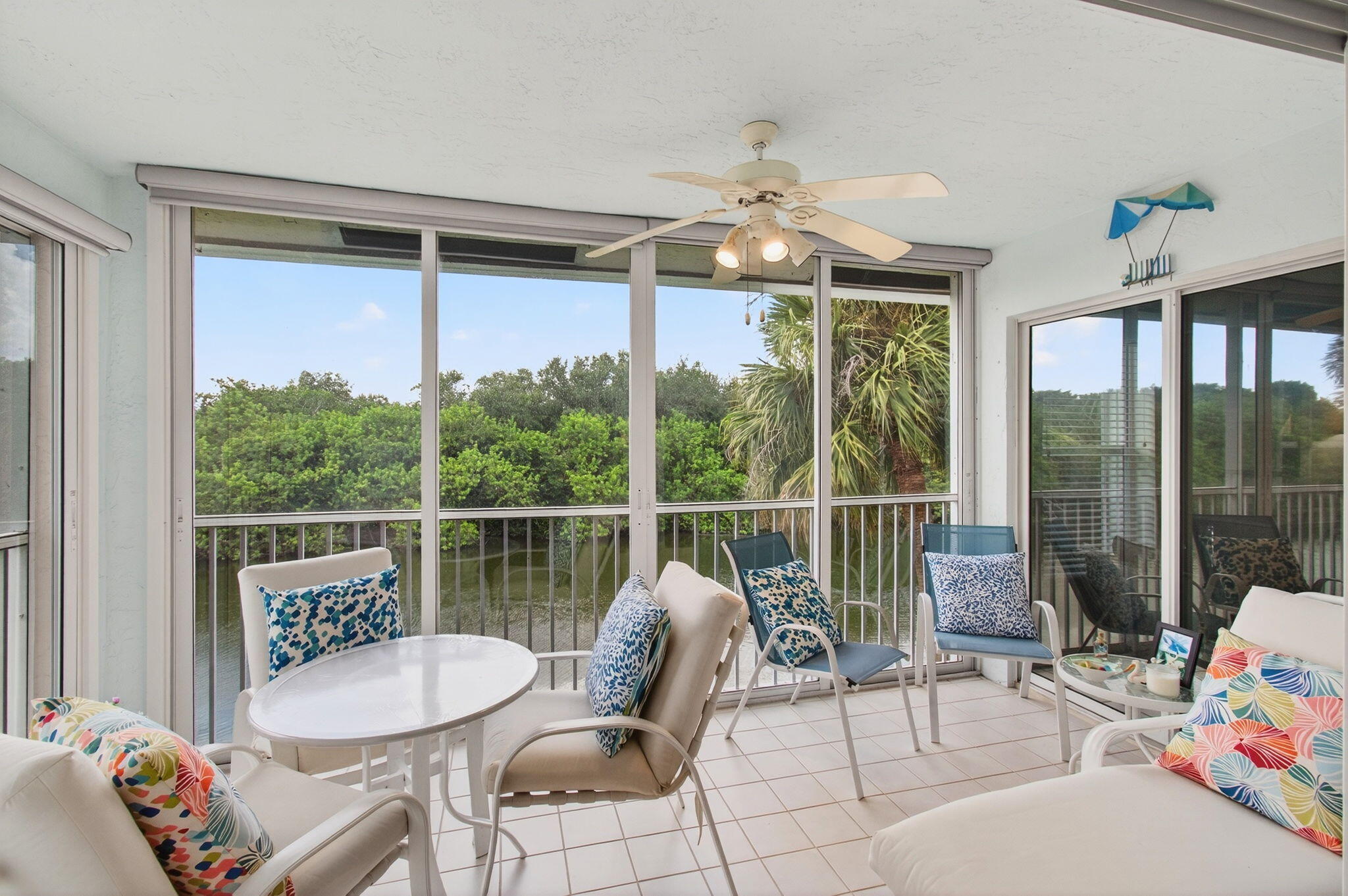 7676 Springwater Place, Unit 201 Boynton Beach, FL 33437 - Photo 14 of 36 a view of a dining room with furniture window and outside view