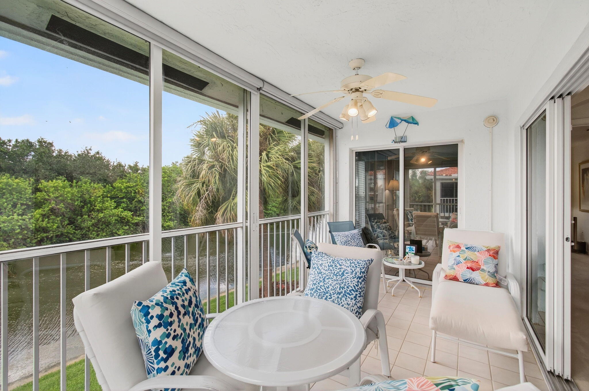 7676 Springwater Place, Unit 201 Boynton Beach, FL 33437 - Photo 15 of 36 a view of a dining room with furniture window and outside view