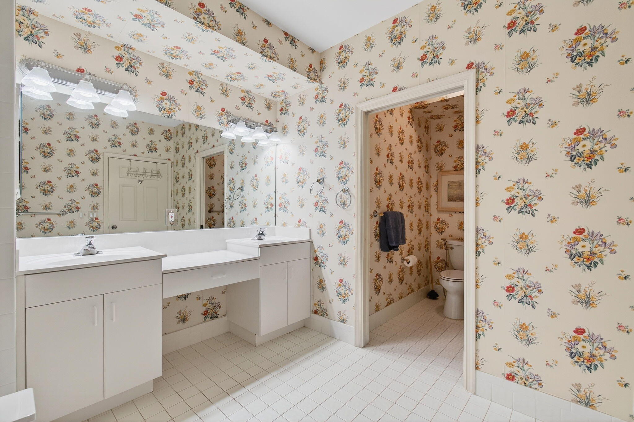 7676 Springwater Place, Unit 201 Boynton Beach, FL 33437 - Photo 25 of 36 a spacious bathroom with a shower and a sink