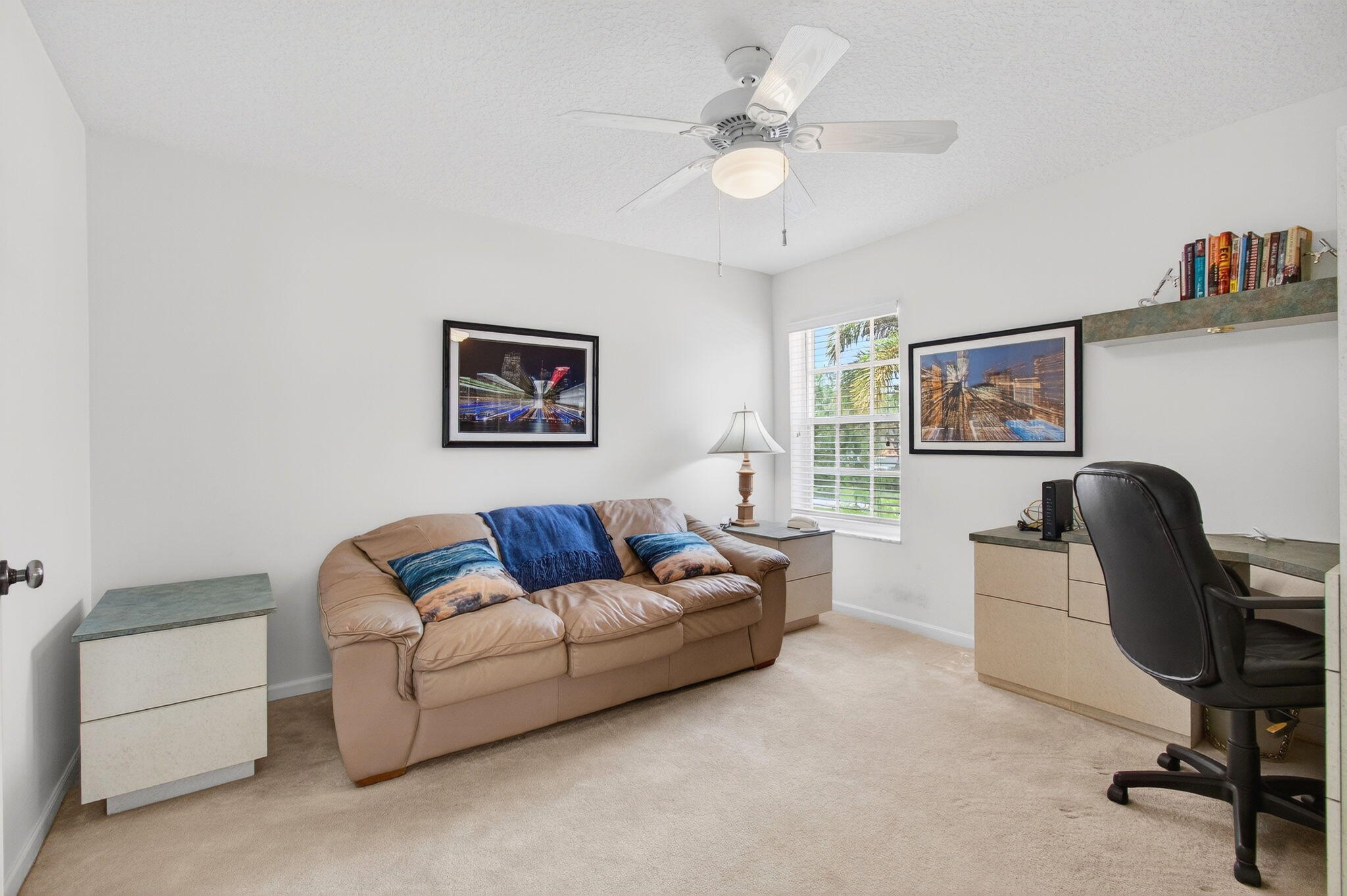 7676 Springwater Place, Unit 201 Boynton Beach, FL 33437 - Photo 26 of 36 a living room with furniture and a window