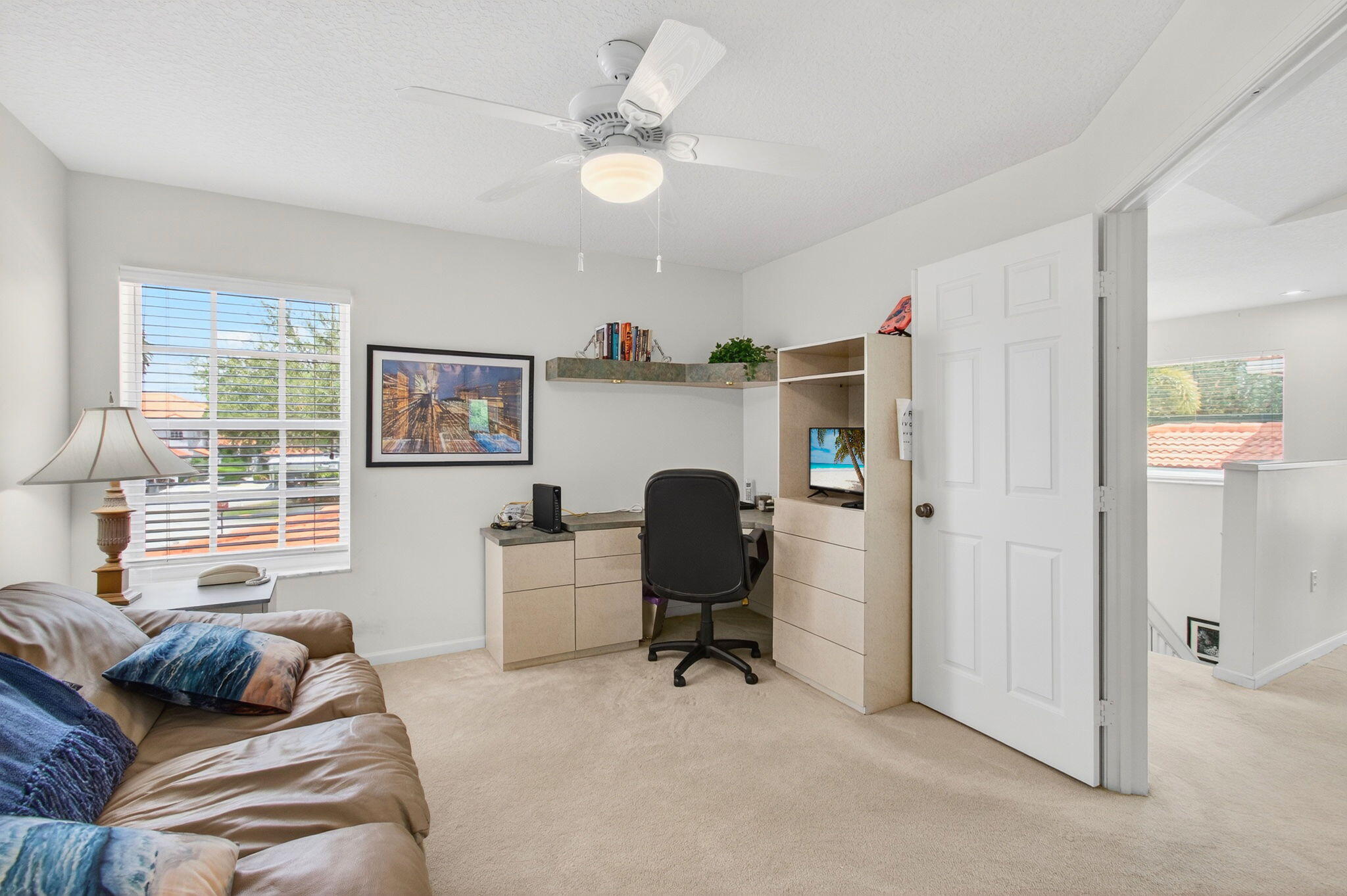 7676 Springwater Place, Unit 201 Boynton Beach, FL 33437 - Photo 27 of 36 a workspace with furniture and a window