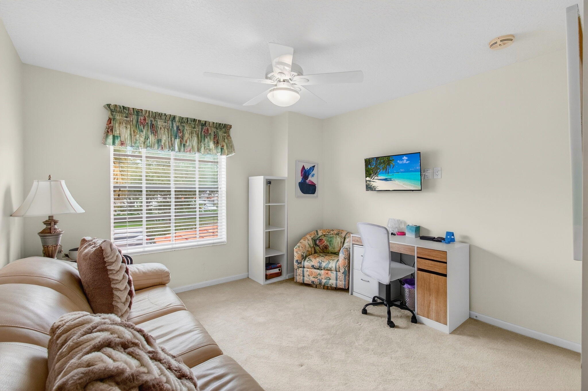 7676 Springwater Place, Unit 201 Boynton Beach, FL 33437 - Photo 30 of 36 a living room with furniture and a window