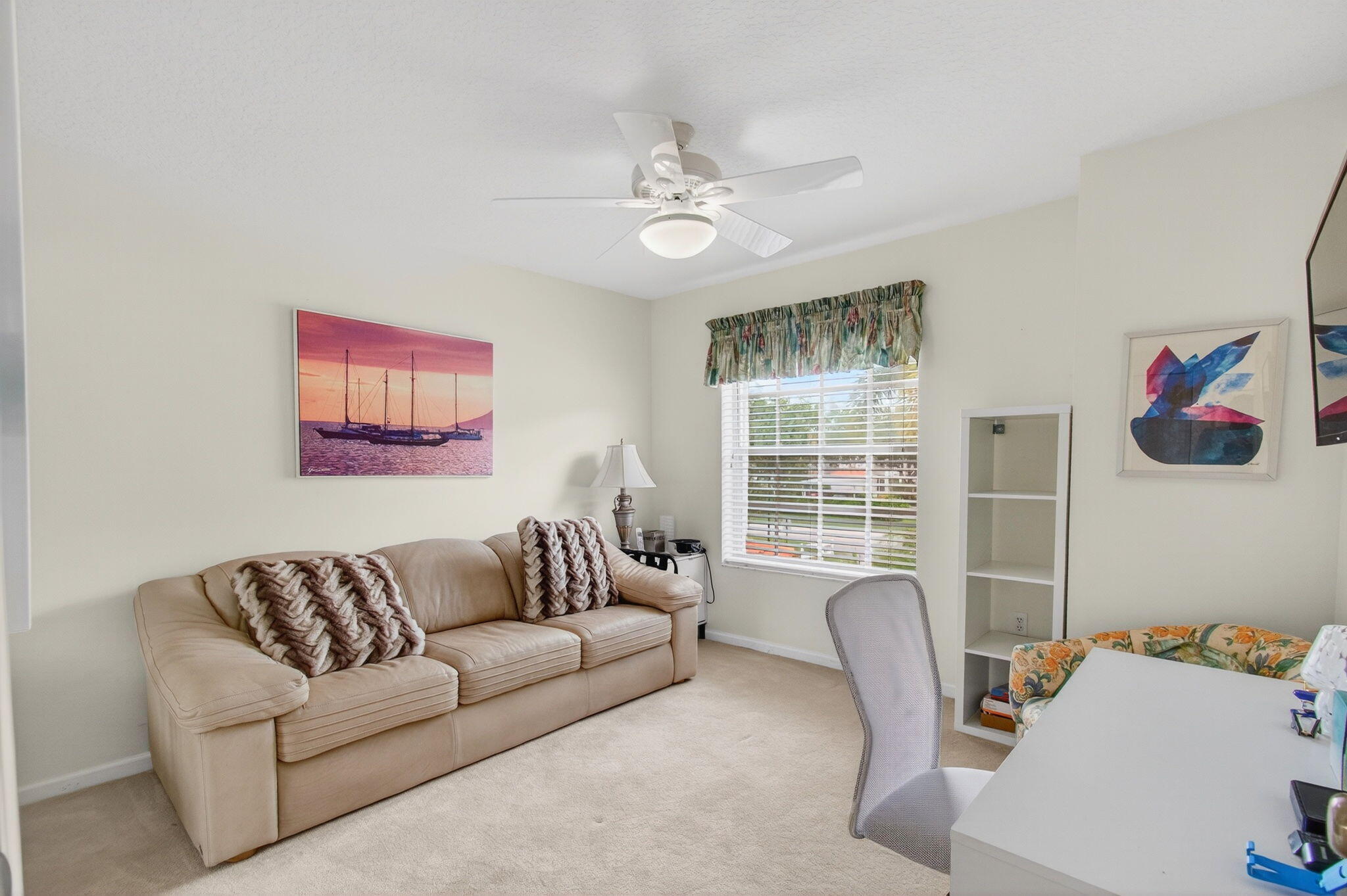 7676 Springwater Place, Unit 201 Boynton Beach, FL 33437 - Photo 31 of 36 a living room with furniture and a window