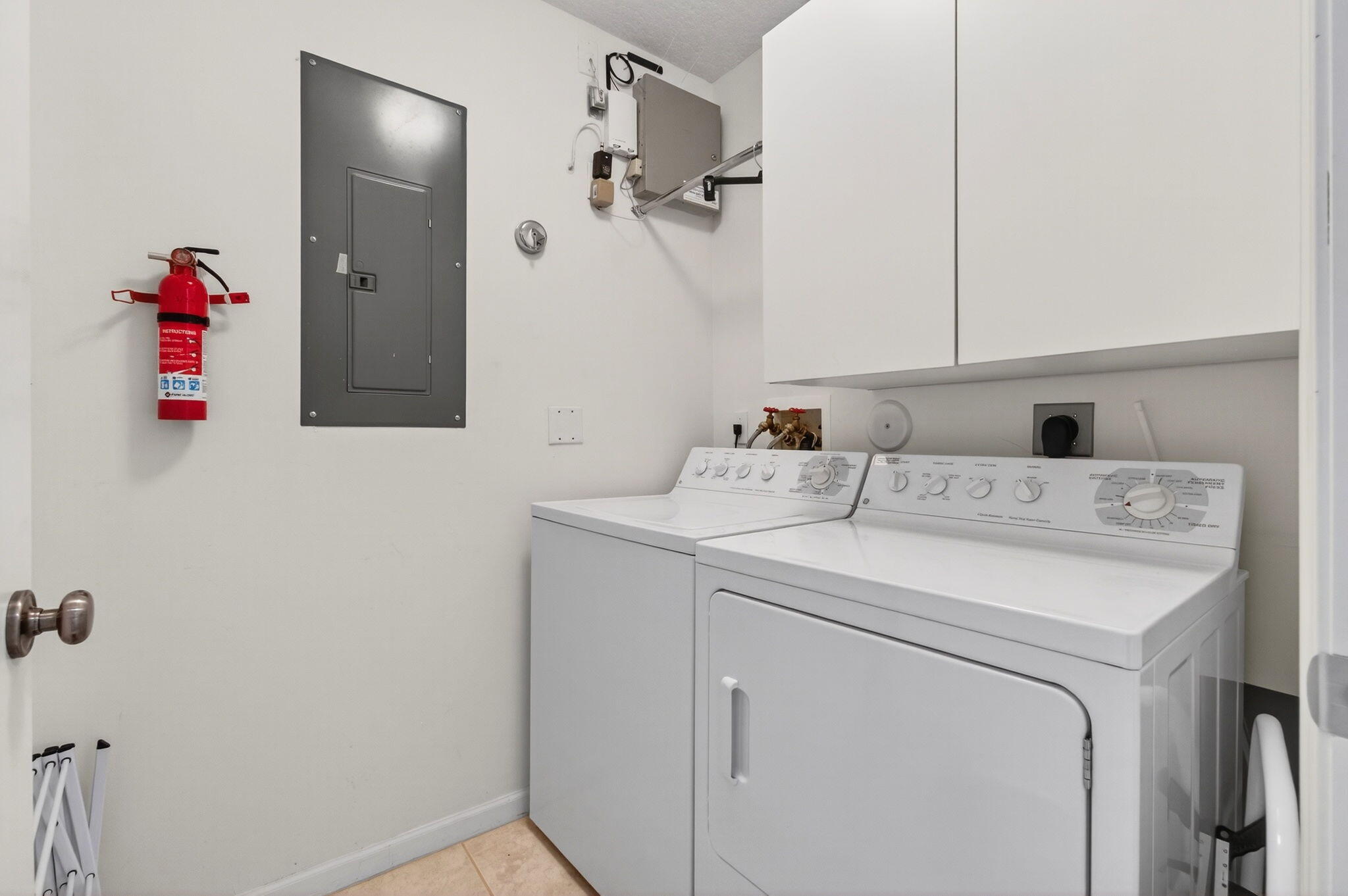 7676 Springwater Place, Unit 201 Boynton Beach, FL 33437 - Photo 32 of 36 a utility room with dryer and washer