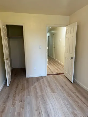 a view of wooden floor in an empty room