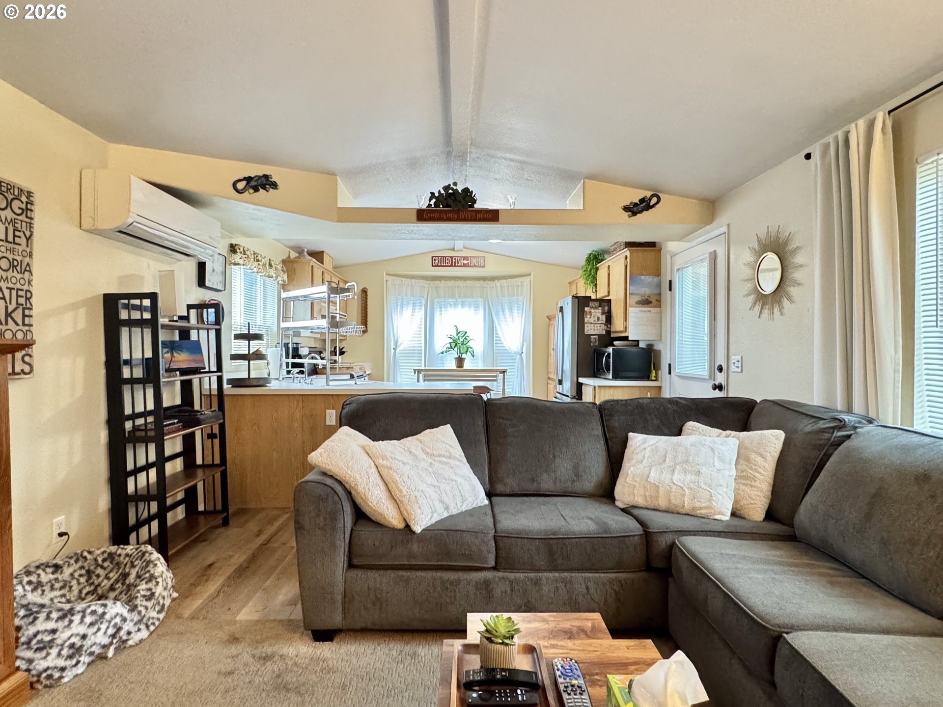 3760 Highway 101, Unit 1 Florence, OR 97439 - Photo 16 of 32 a living room with furniture and view of kitchen