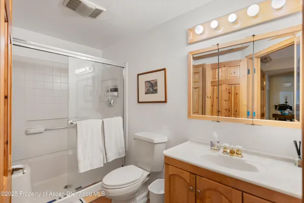a view of a patio with a table and chairs