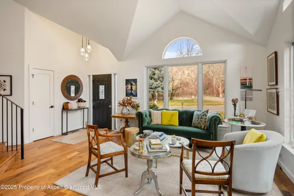 a living room with furniture and a large window