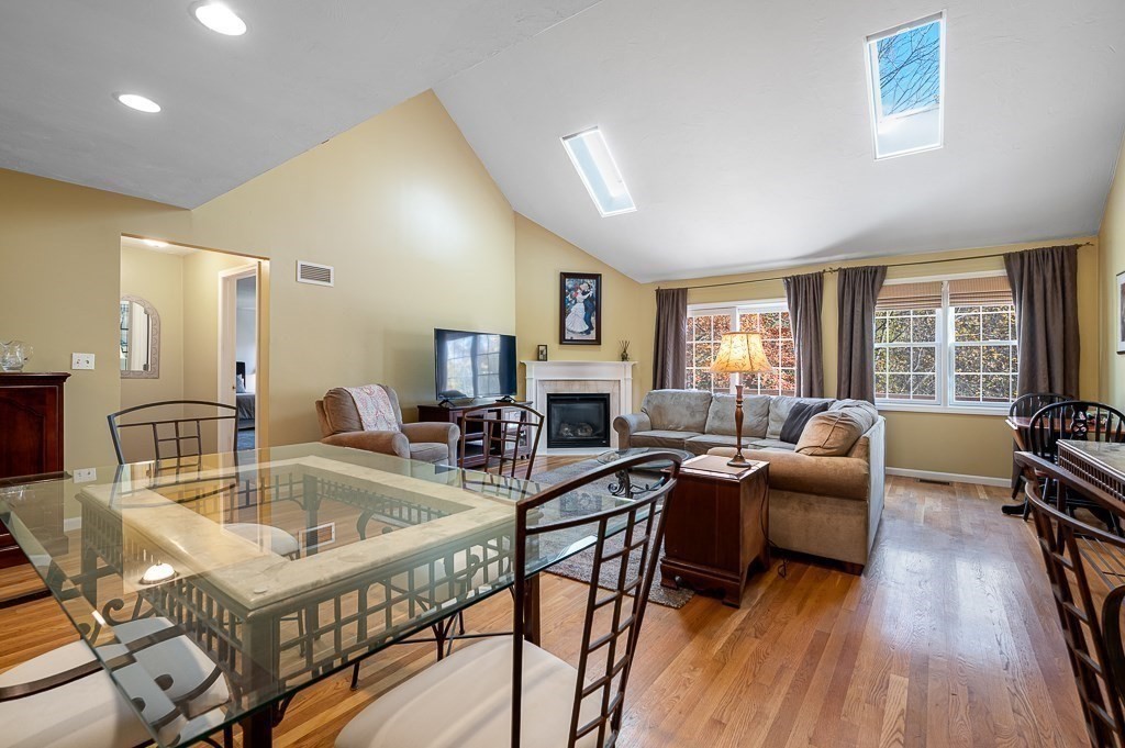 115 Ariel Circle, Unit 115 Sutton, MA 01590 - Photo 13 of 39 a work room with furniture and a wooden floor