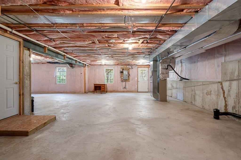 115 Ariel Circle, Unit 115 Sutton, MA 01590 - Photo 29 of 39 a view of a room with wooden walls