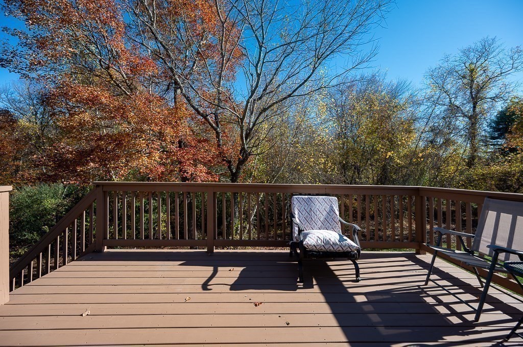 115 Ariel Circle, Unit 115 Sutton, MA 01590 - Photo 33 of 39 a view of balcony with wooden floor and outdoor seating