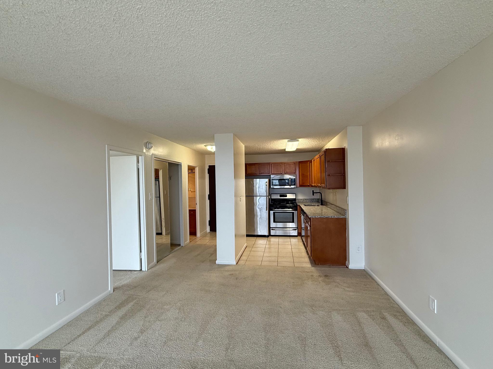 5225 Pooks Hill Road, Unit 1517N Bethesda, MD 20814 - Photo 2 of 30 a view of a big room with closet and a window