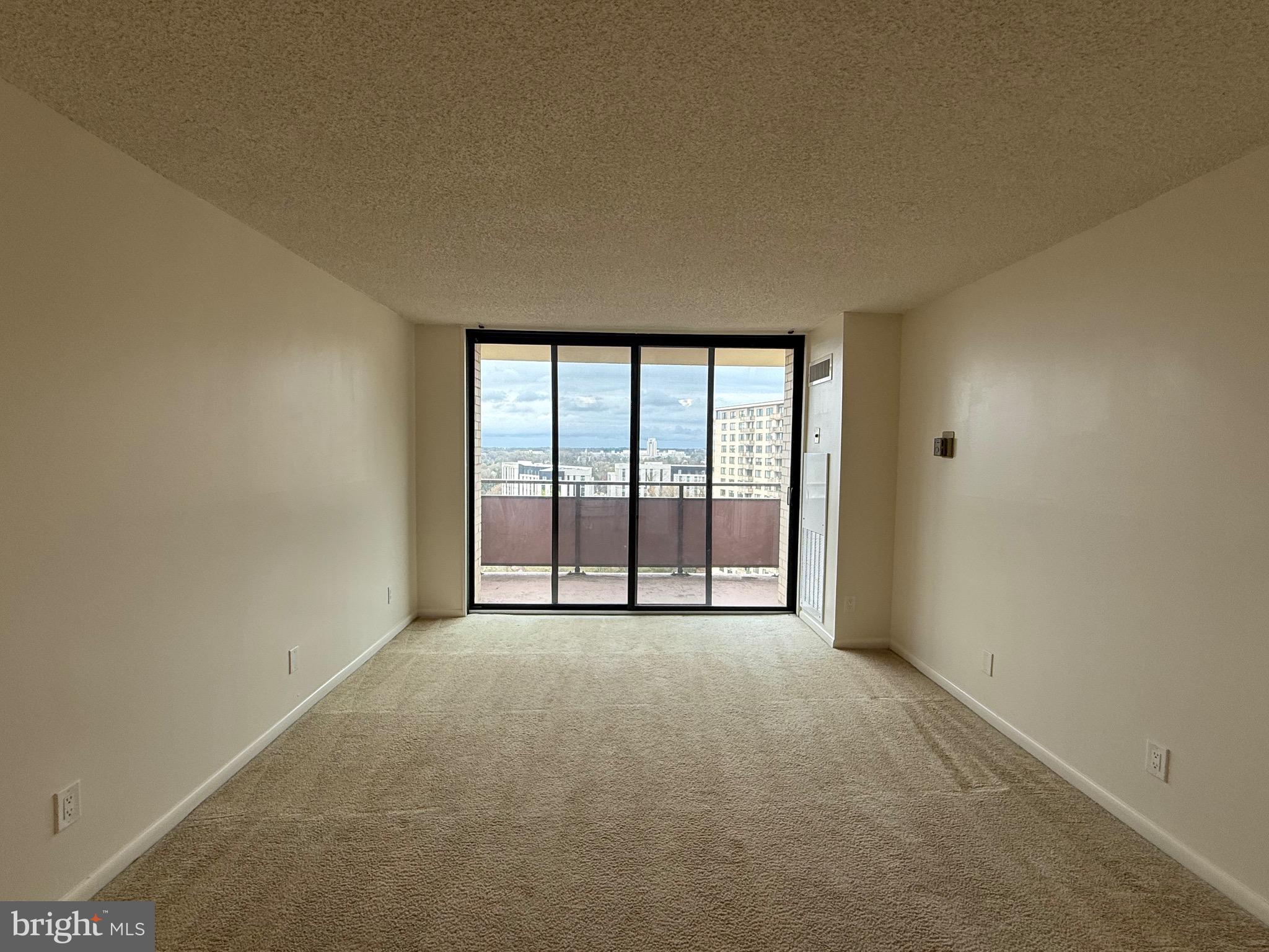 5225 Pooks Hill Road, Unit 1517N Bethesda, MD 20814 - Photo 4 of 30 wooden floor and window in an empty room