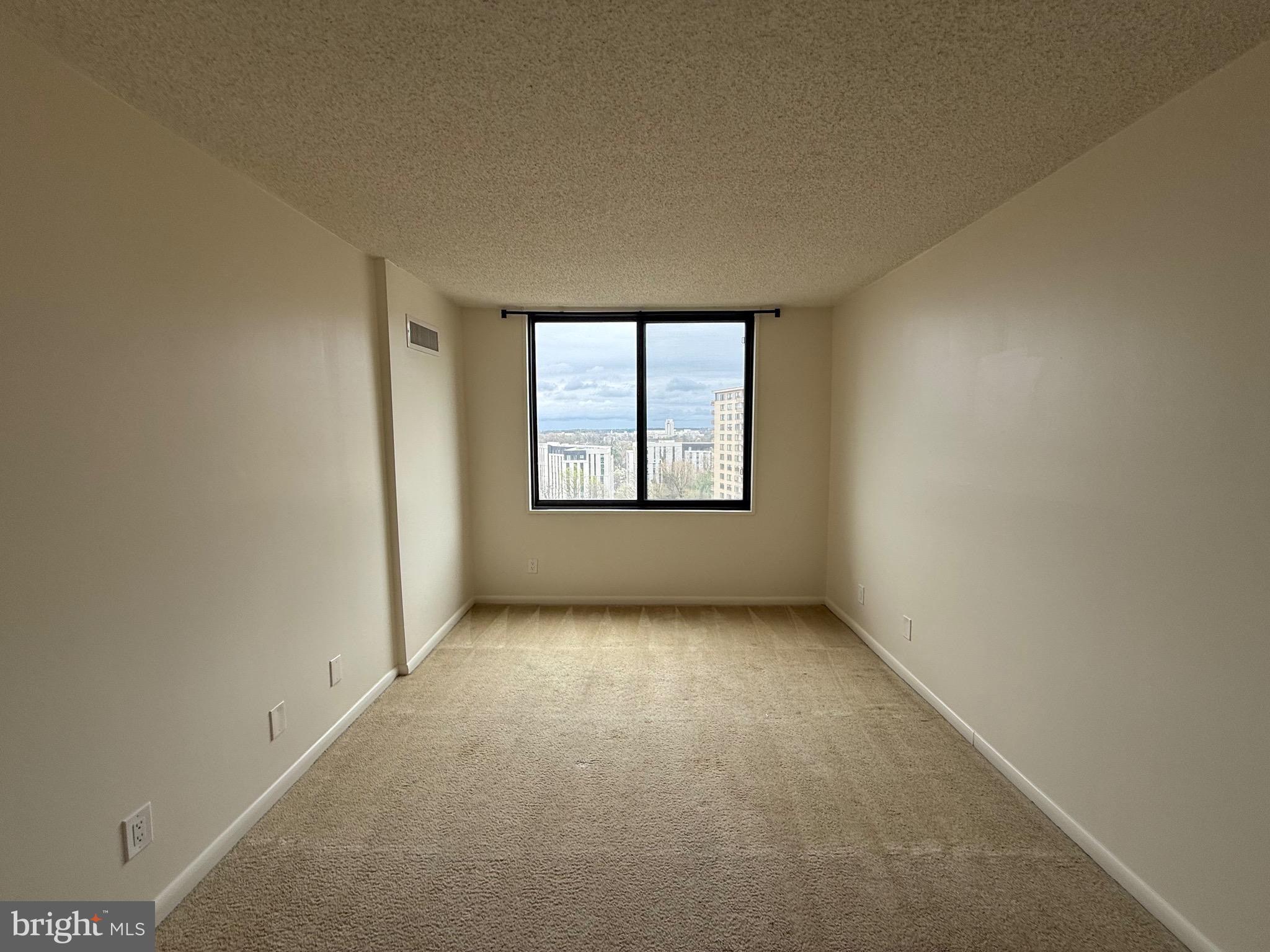 5225 Pooks Hill Road, Unit 1517N Bethesda, MD 20814 - Photo 7 of 30 an empty room with windows