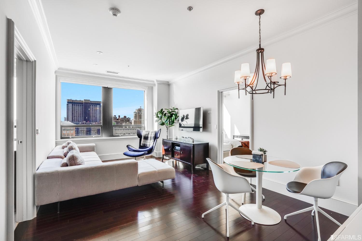 690 Market Street, Unit 1802 San Francisco, CA 94104 - Photo 1 of 34 a living room with furniture a dining table and a chandelier