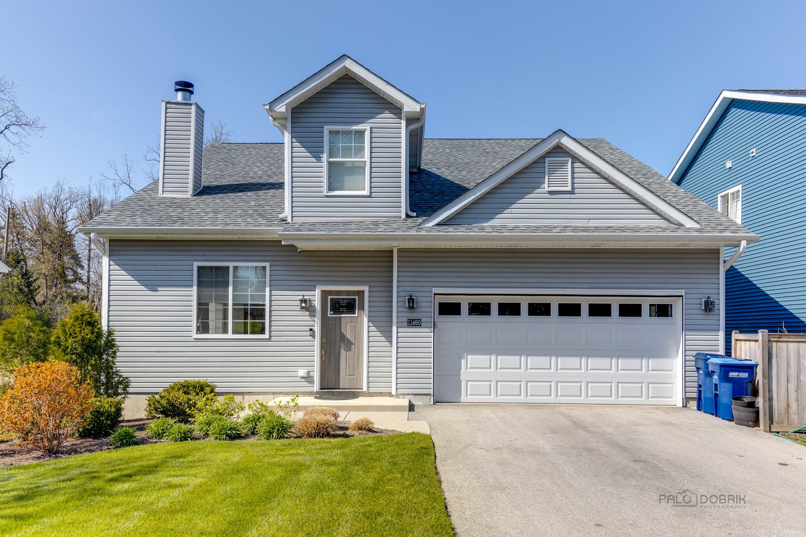 228 Juneway Terrace Lake Bluff, IL 60044 - Photo 1 of 1 a front view of a house with a yard and garage