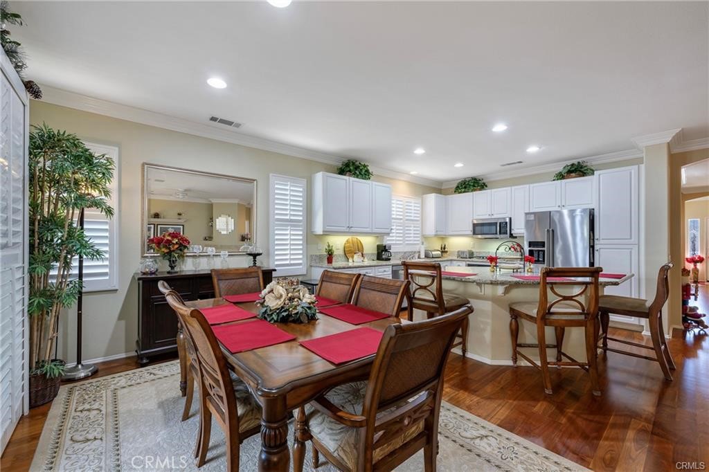 27956 Crystal Spring Drive Menifee, CA 92584 - Photo 11 of 25 a view of a dining room with furniture