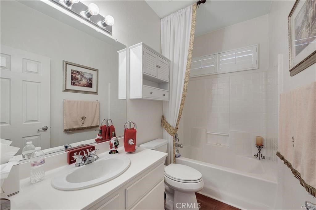 27956 Crystal Spring Drive Menifee, CA 92584 - Photo 17 of 25 a bathroom with a sink a toilet and shower