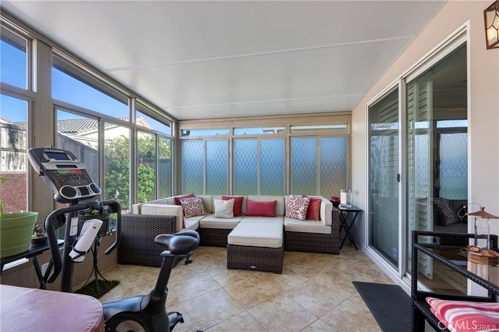 27956 Crystal Spring Drive Menifee, CA 92584 - Photo 18 of 25 a living room with furniture and large windows