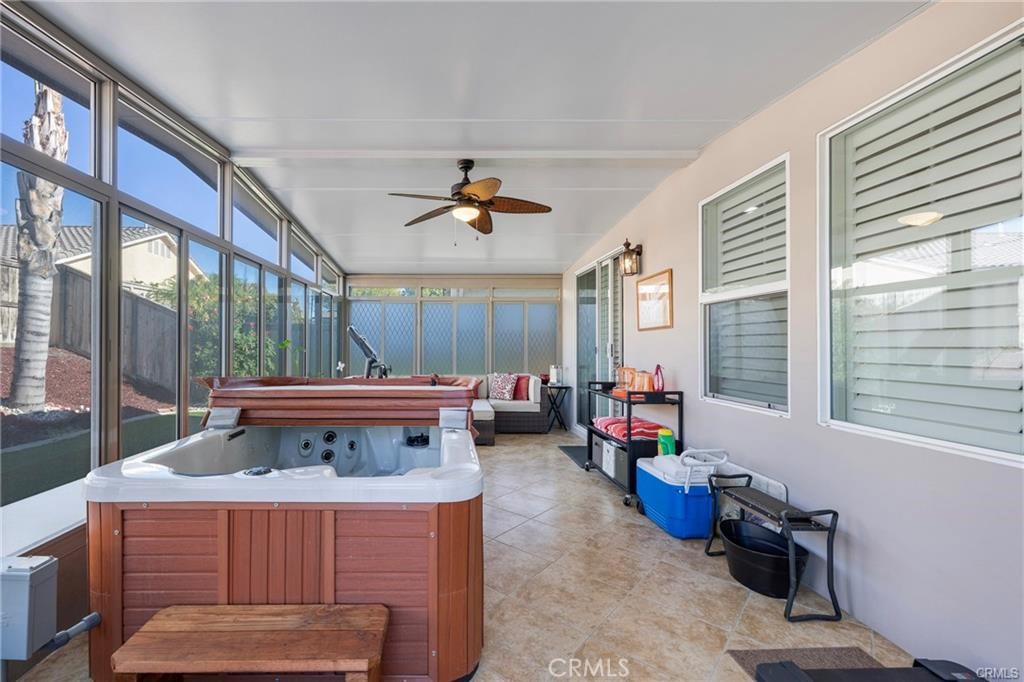 27956 Crystal Spring Drive Menifee, CA 92584 - Photo 19 of 25 a living room with furniture and a flat screen tv
