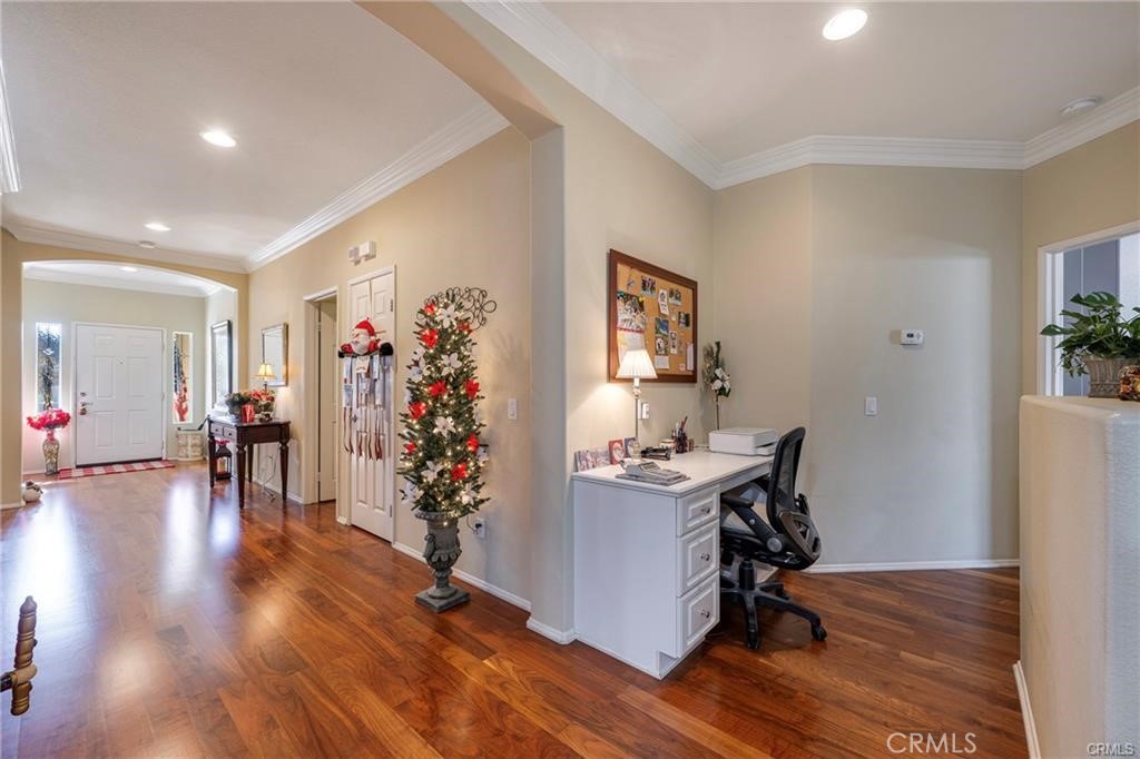 27956 Crystal Spring Drive Menifee, CA 92584 - Photo 4 of 25 a view of a livingroom with workspace and a couch