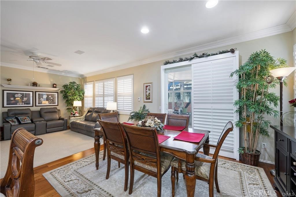 27956 Crystal Spring Drive Menifee, CA 92584 - Photo 10 of 25 a living room with furniture and a potted plant