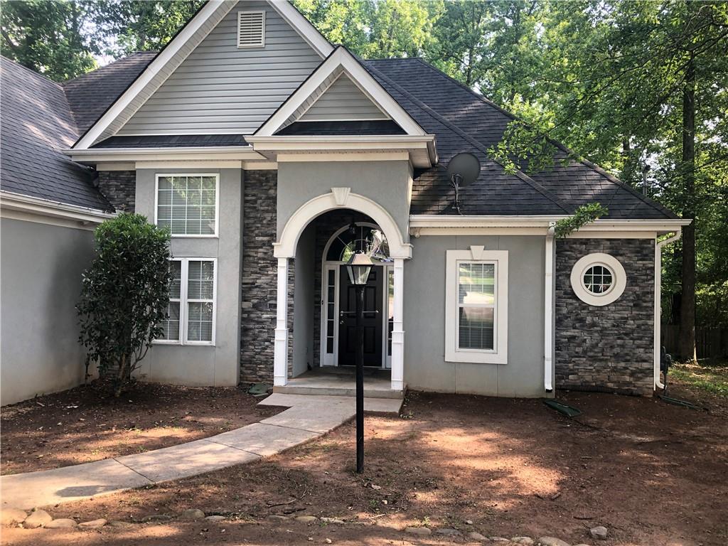 848 Windy Mill Court Temple, GA 30179 - Photo 1 of 19 a front view of a house with garden