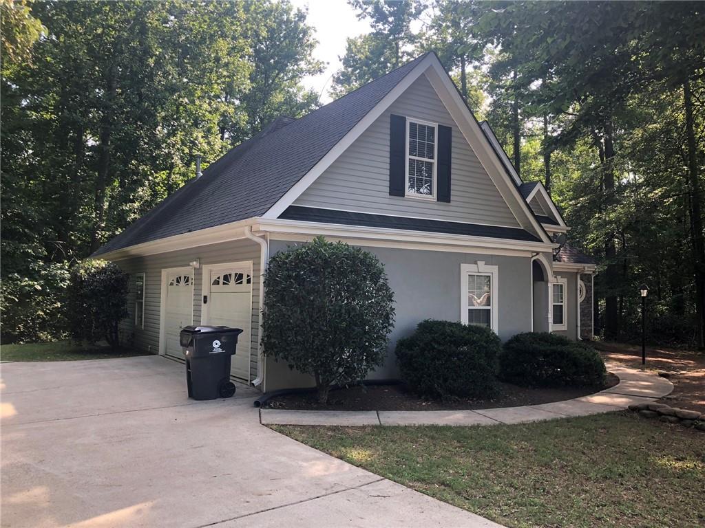 848 Windy Mill Court Temple, GA 30179 - Photo 3 of 19 a front view of a house with garden