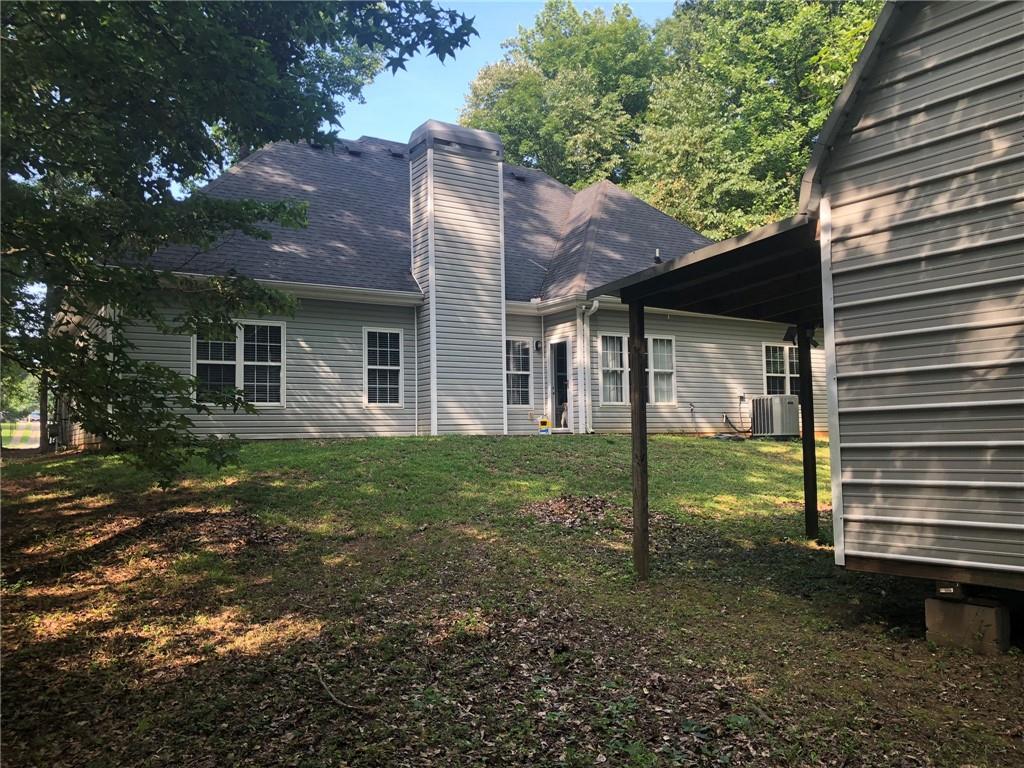 848 Windy Mill Court Temple, GA 30179 - Photo 8 of 19 a view of a house with backyard and a tree