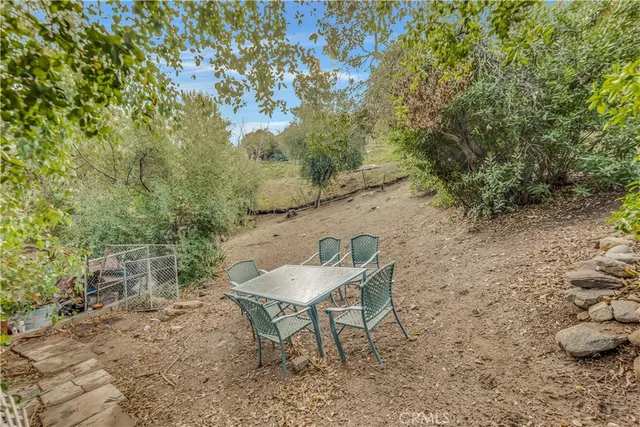 a view of a chairs and table in the outdoor