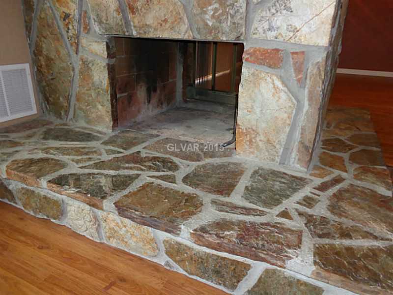 225 South Roland Wiley Las Vegas, NV 89145 - Photo 3 of 14 Living Room. WOOD BURNING FIRE PLACE