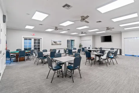 a room with lots of furniture and a flat screen tv