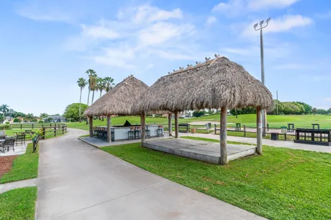 a house with swimming pool in front of it