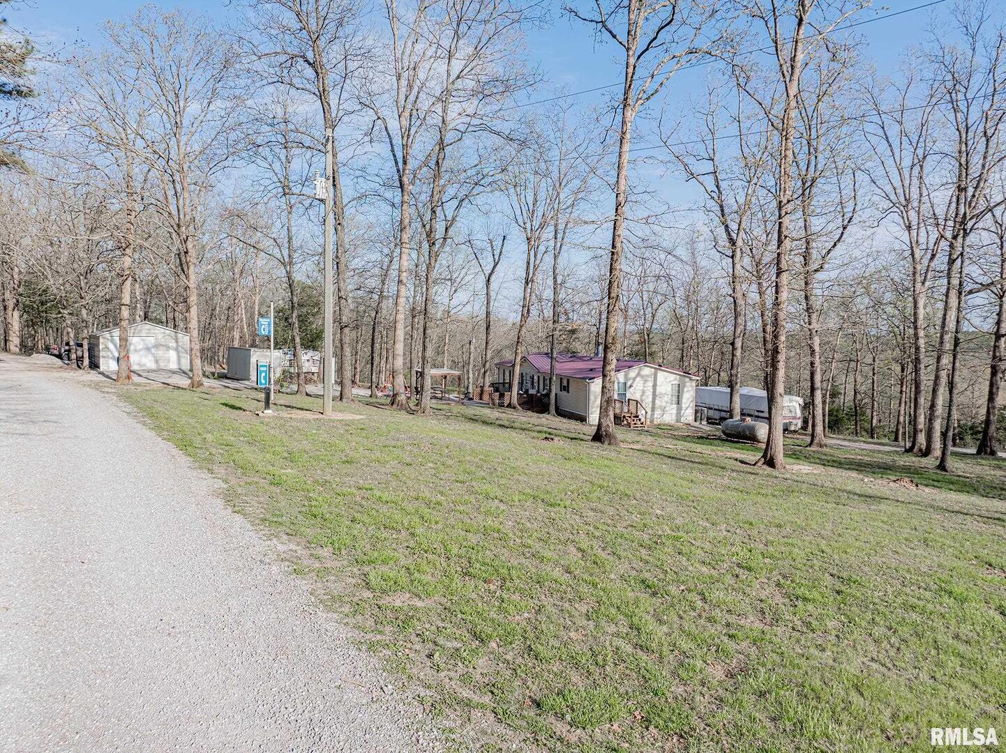 565 Dutton Chapel Road Herod, IL 62947 - Photo 32 of 54 a backyard of apartments with large trees