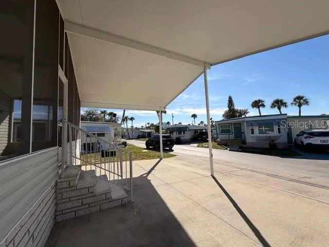 a view of a swimming pool with seating area