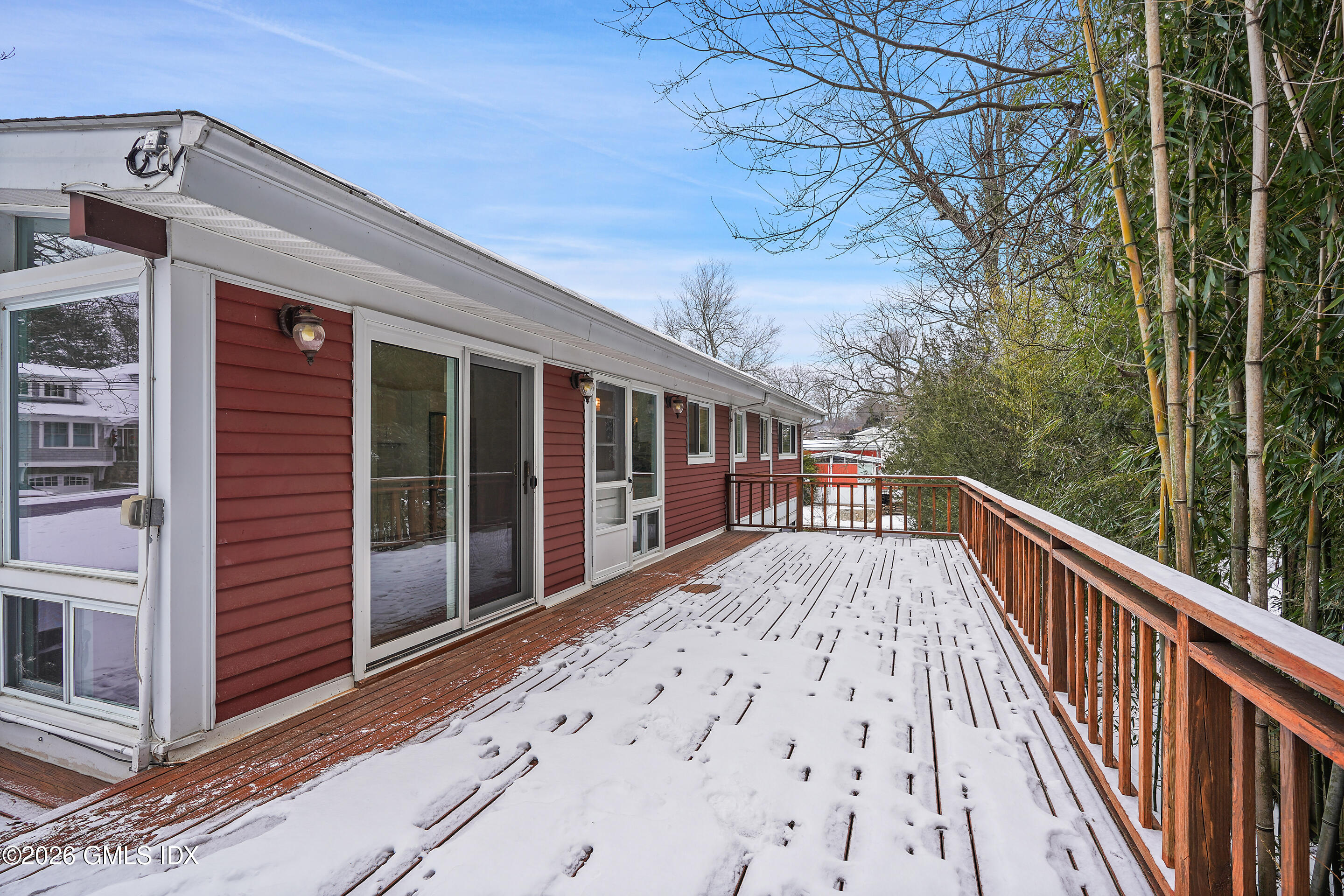 4 Split Timber Place Riverside, CT 06878 - Photo 14 of 38 a view of a balcony with wooden floor and fence