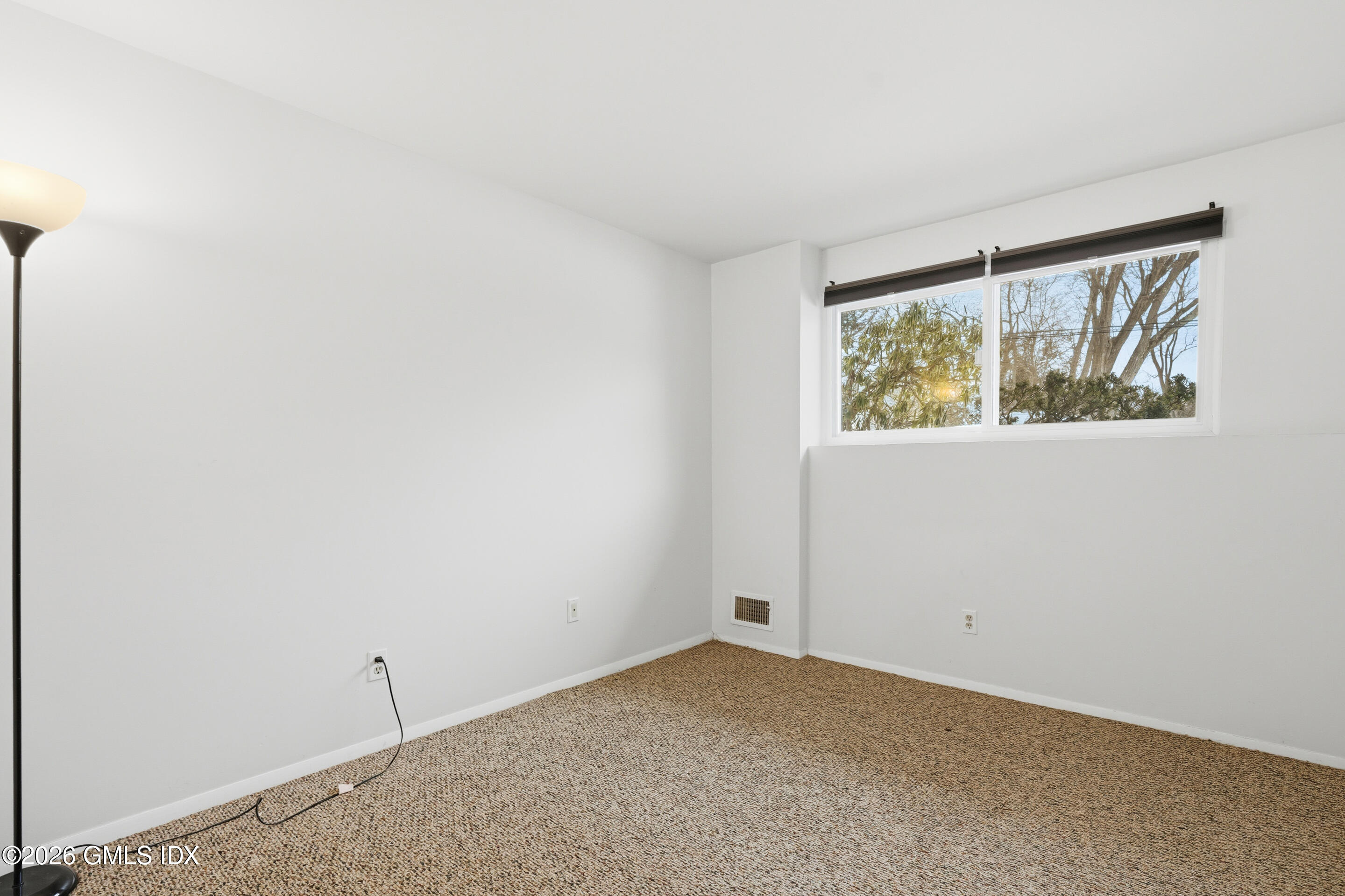 4 Split Timber Place Riverside, CT 06878 - Photo 20 of 38 an empty room with windows