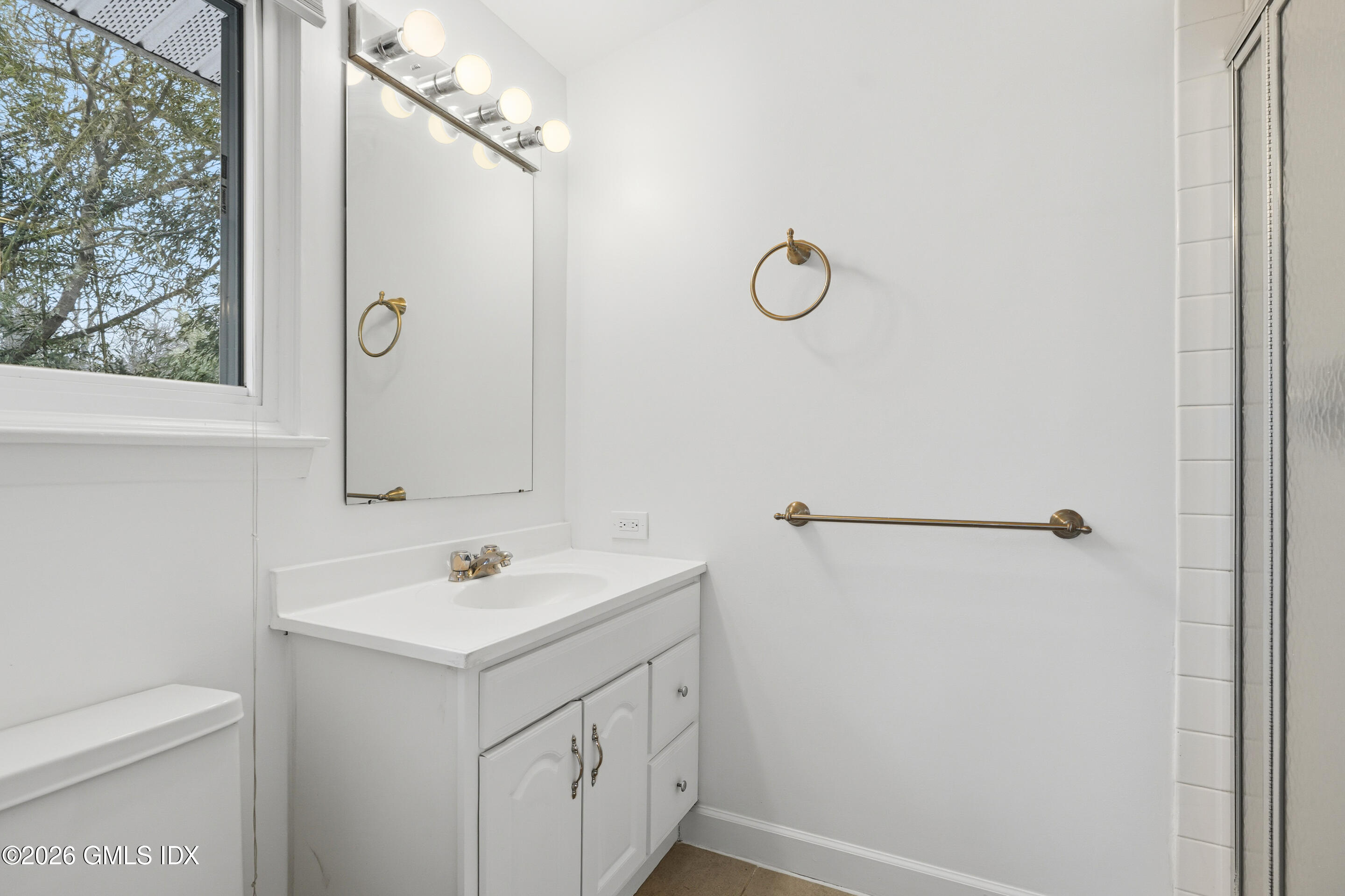 4 Split Timber Place Riverside, CT 06878 - Photo 22 of 38 a bathroom with a sink a toilet and shower