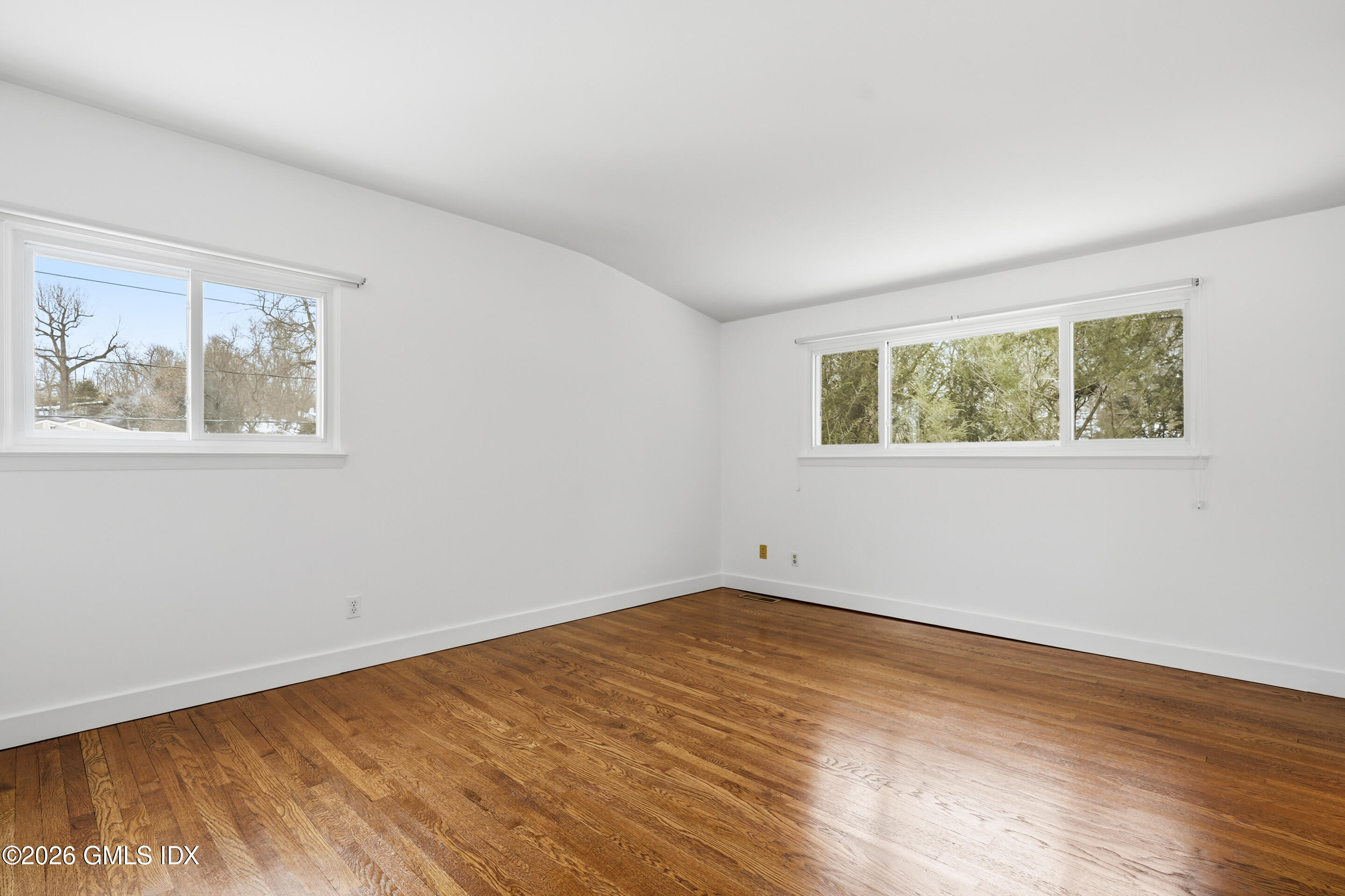 4 Split Timber Place Riverside, CT 06878 - Photo 24 of 38 a view of an empty room with wooden floor and a window