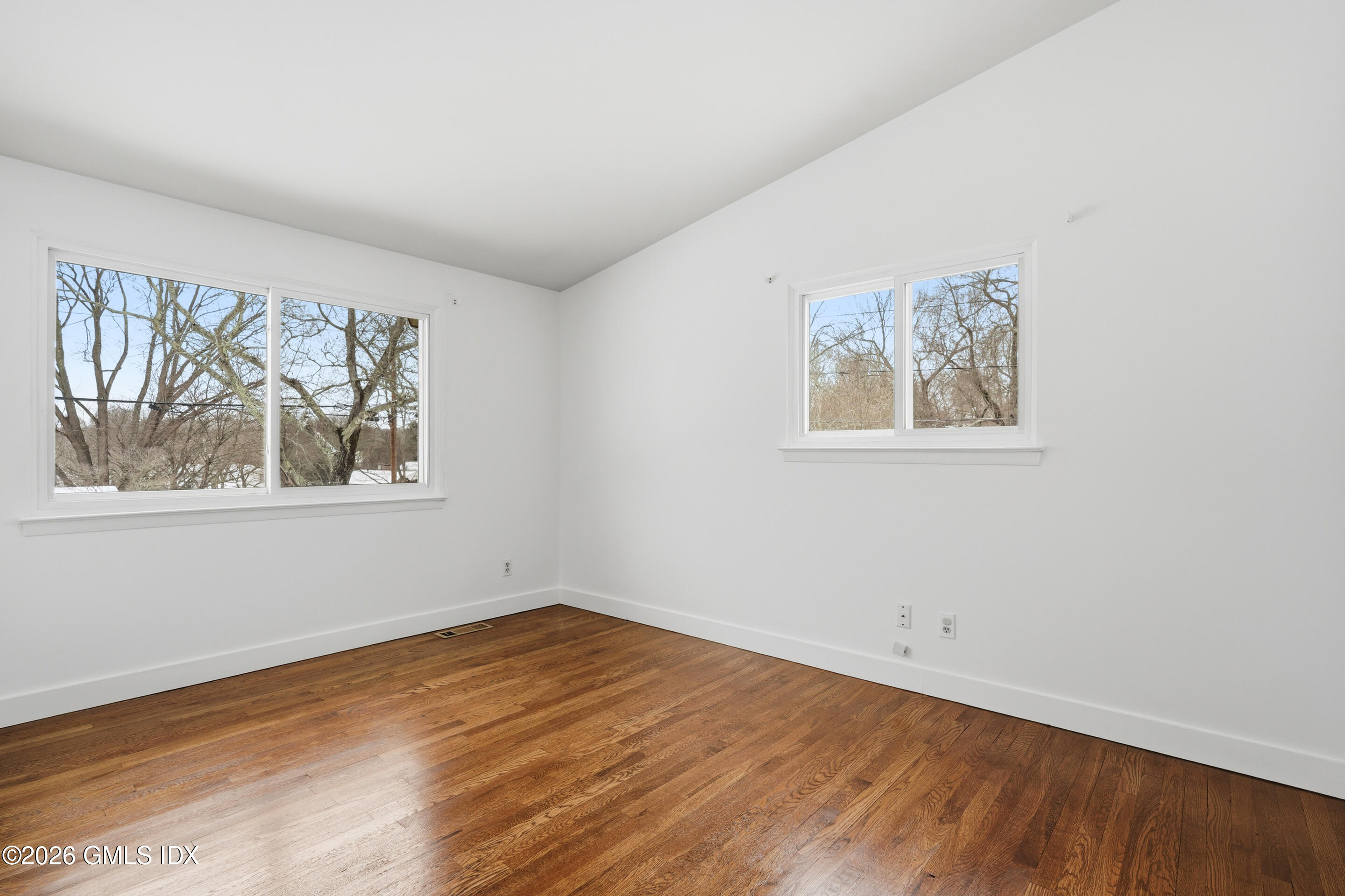 4 Split Timber Place Riverside, CT 06878 - Photo 26 of 38 a view of empty room with window and wooden floor