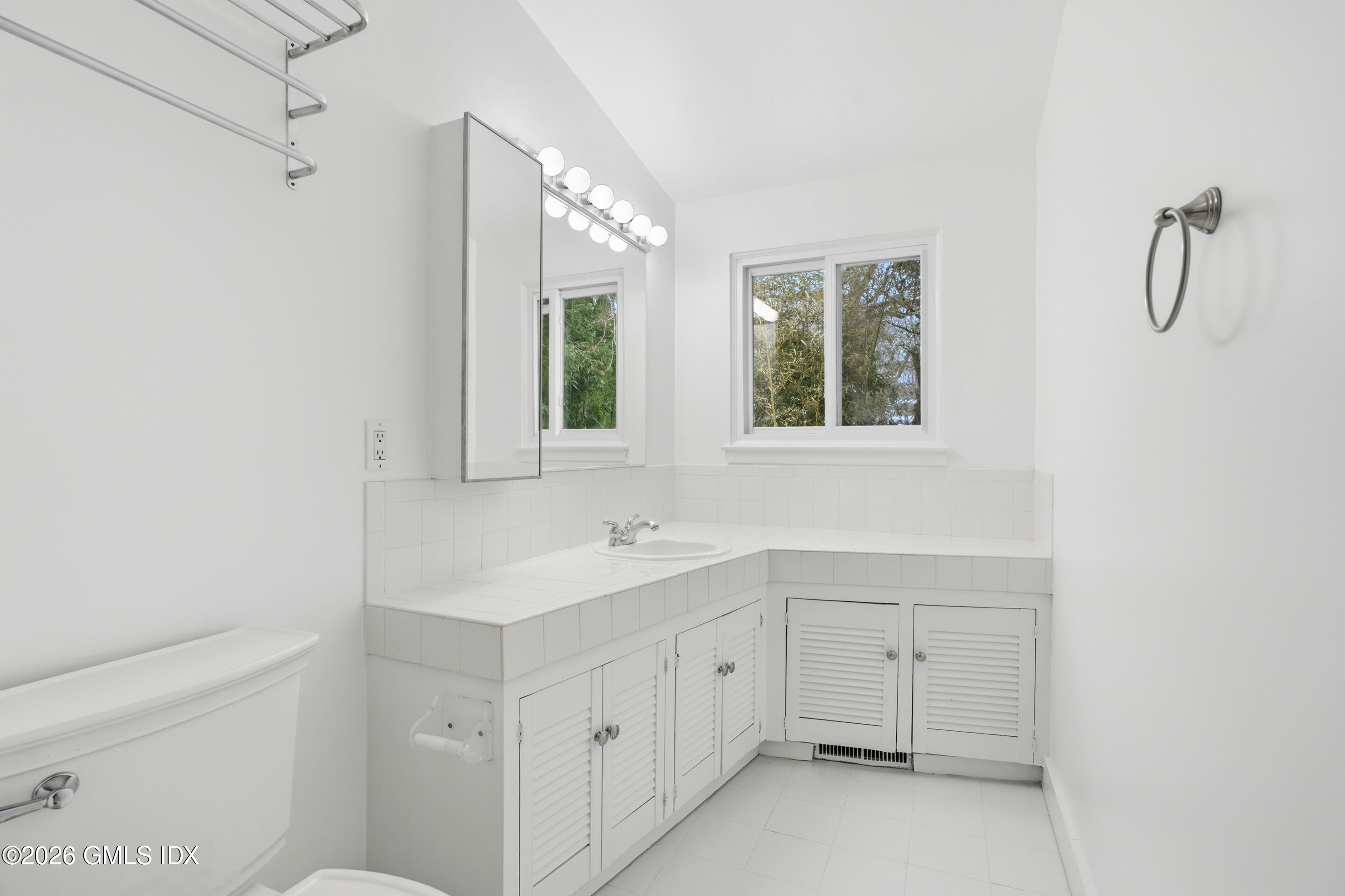 4 Split Timber Place Riverside, CT 06878 - Photo 28 of 38 a bathroom with a sink a toilet and with mirror
