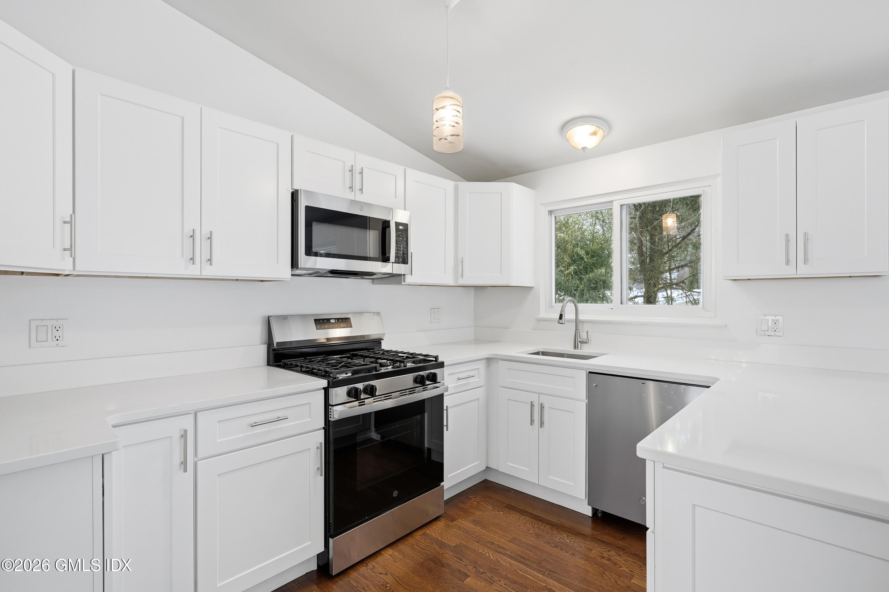 4 Split Timber Place Riverside, CT 06878 - Photo 31 of 38 a kitchen with white cabinets stainless steel appliances and sink