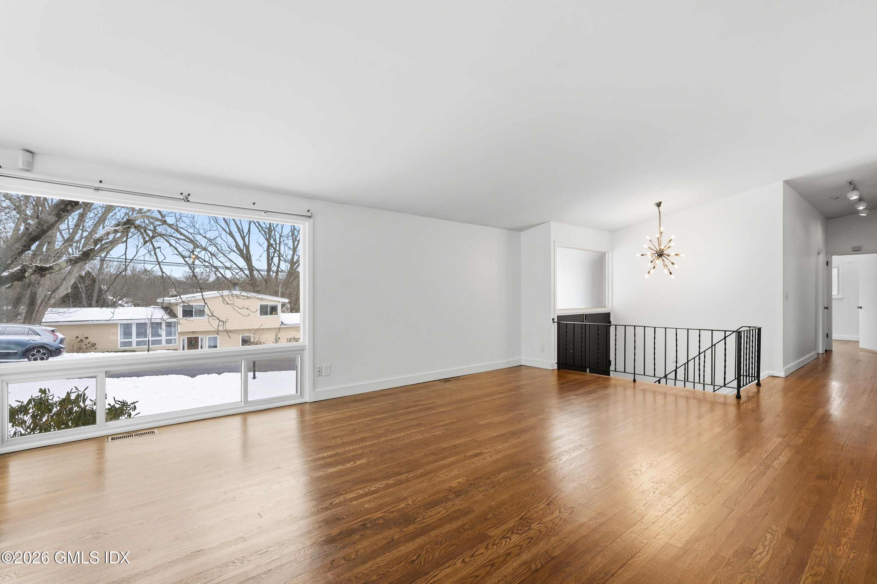 4 Split Timber Place Riverside, CT 06878 - Photo 35 of 38 a view of an empty room with wooden floor and a window