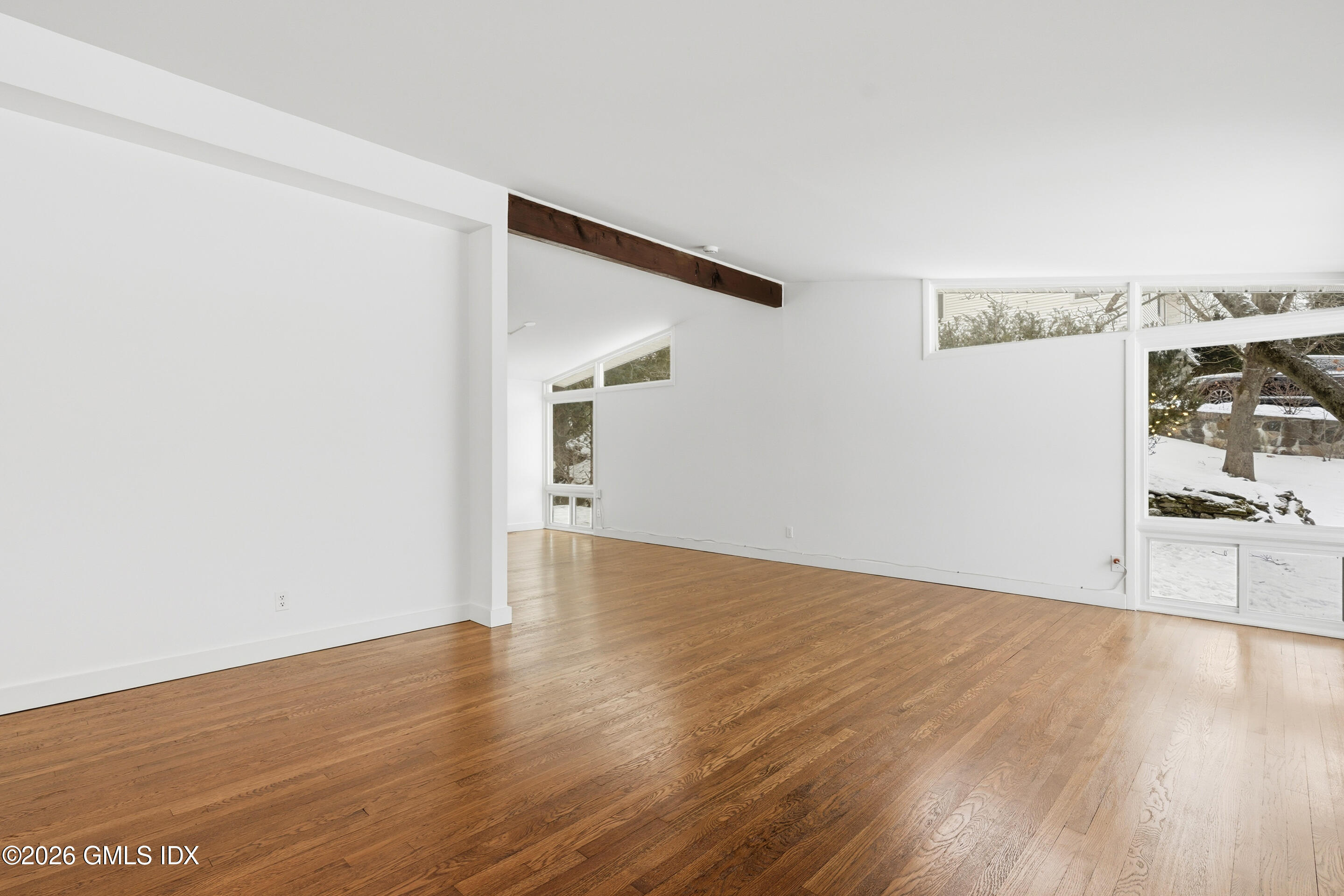 4 Split Timber Place Riverside, CT 06878 - Photo 37 of 38 a view of a big room with wooden floor and windows