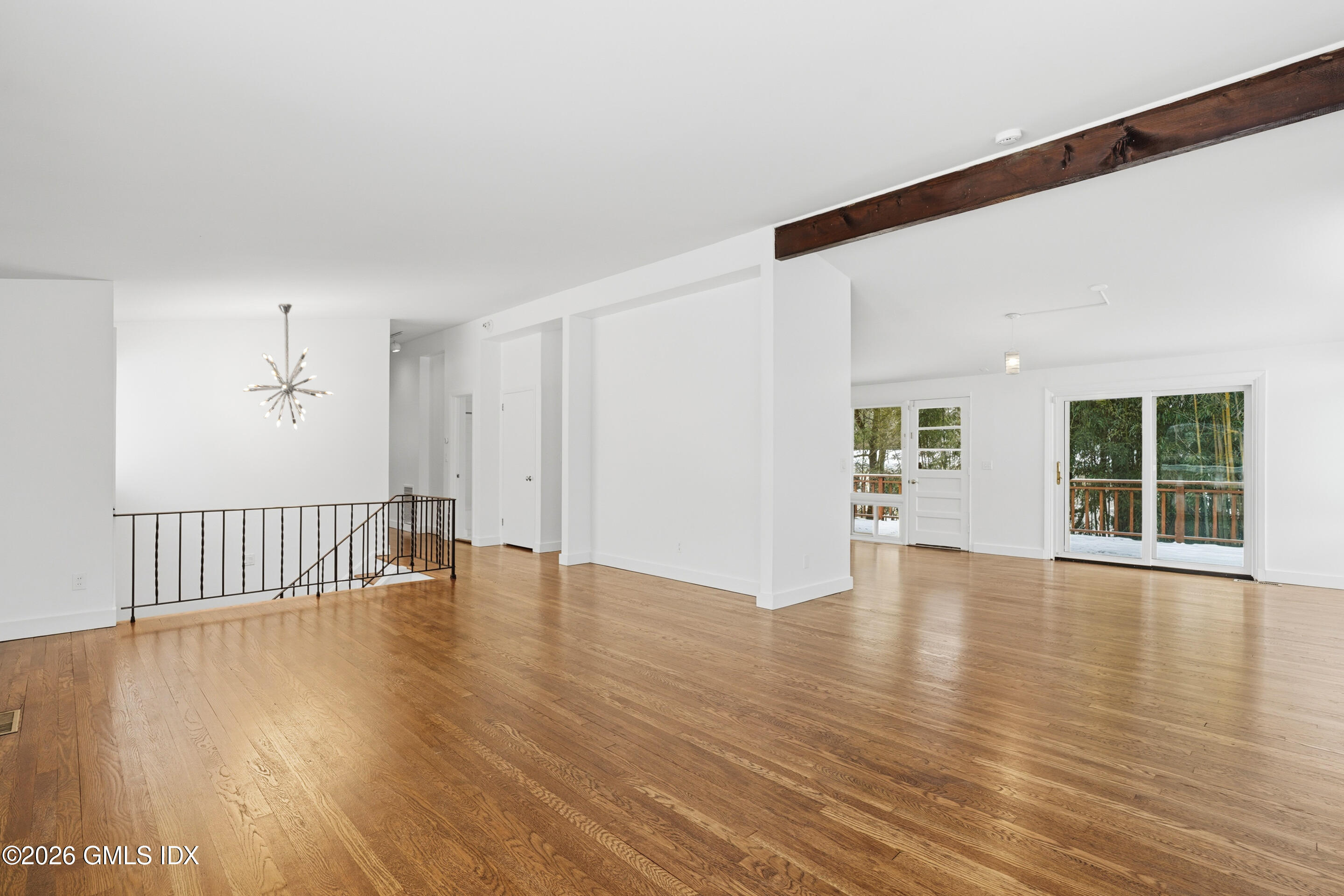 4 Split Timber Place Riverside, CT 06878 - Photo 38 of 38 a view of an empty room with wooden floor and a window