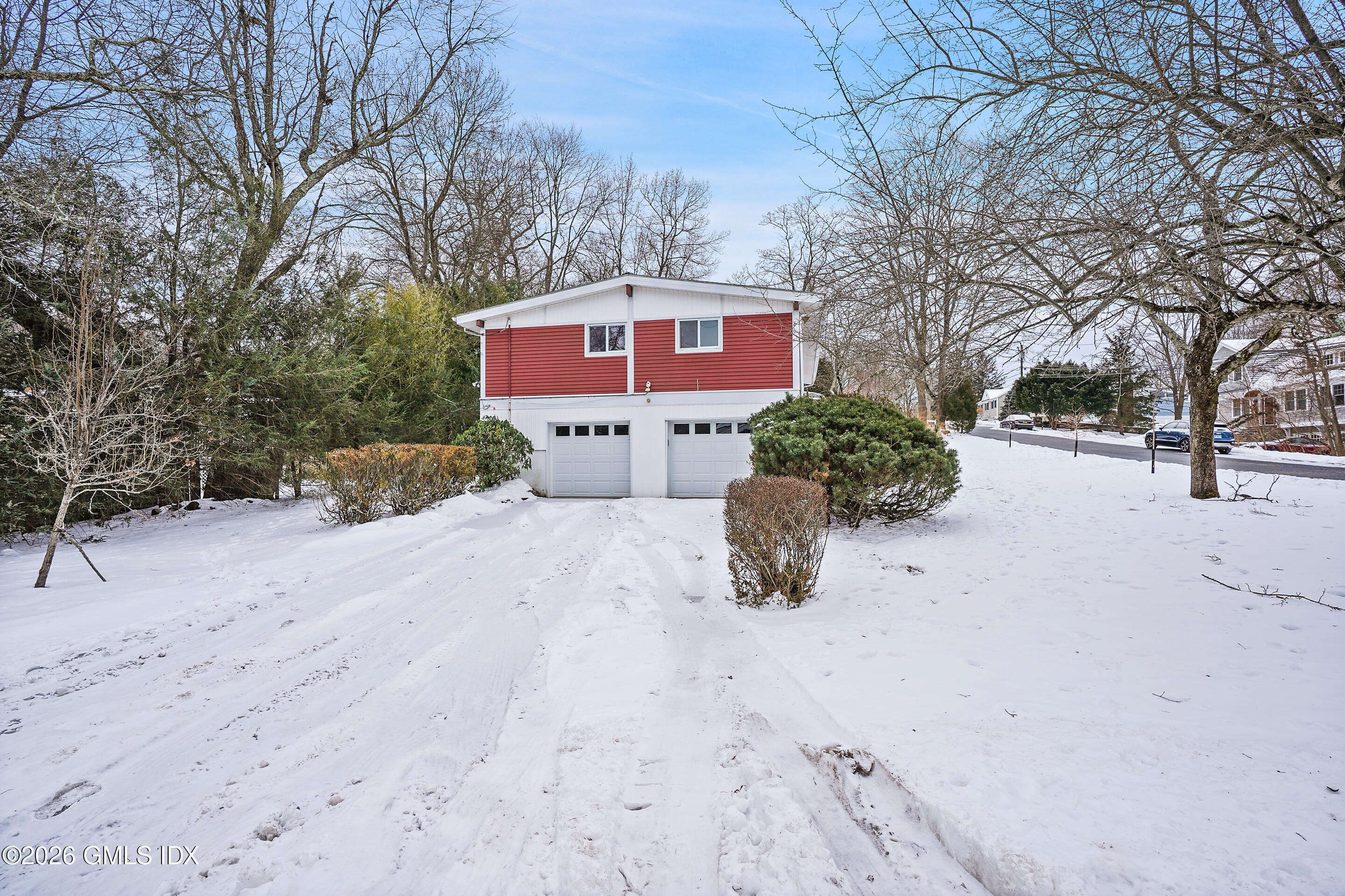 4 Split Timber Place Riverside, CT 06878 - Photo 10 of 38 a red and white house with a outdoor space
