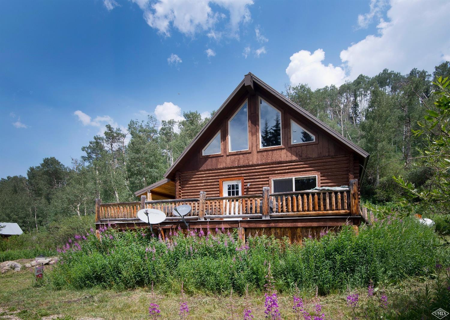 a house with trees in the background