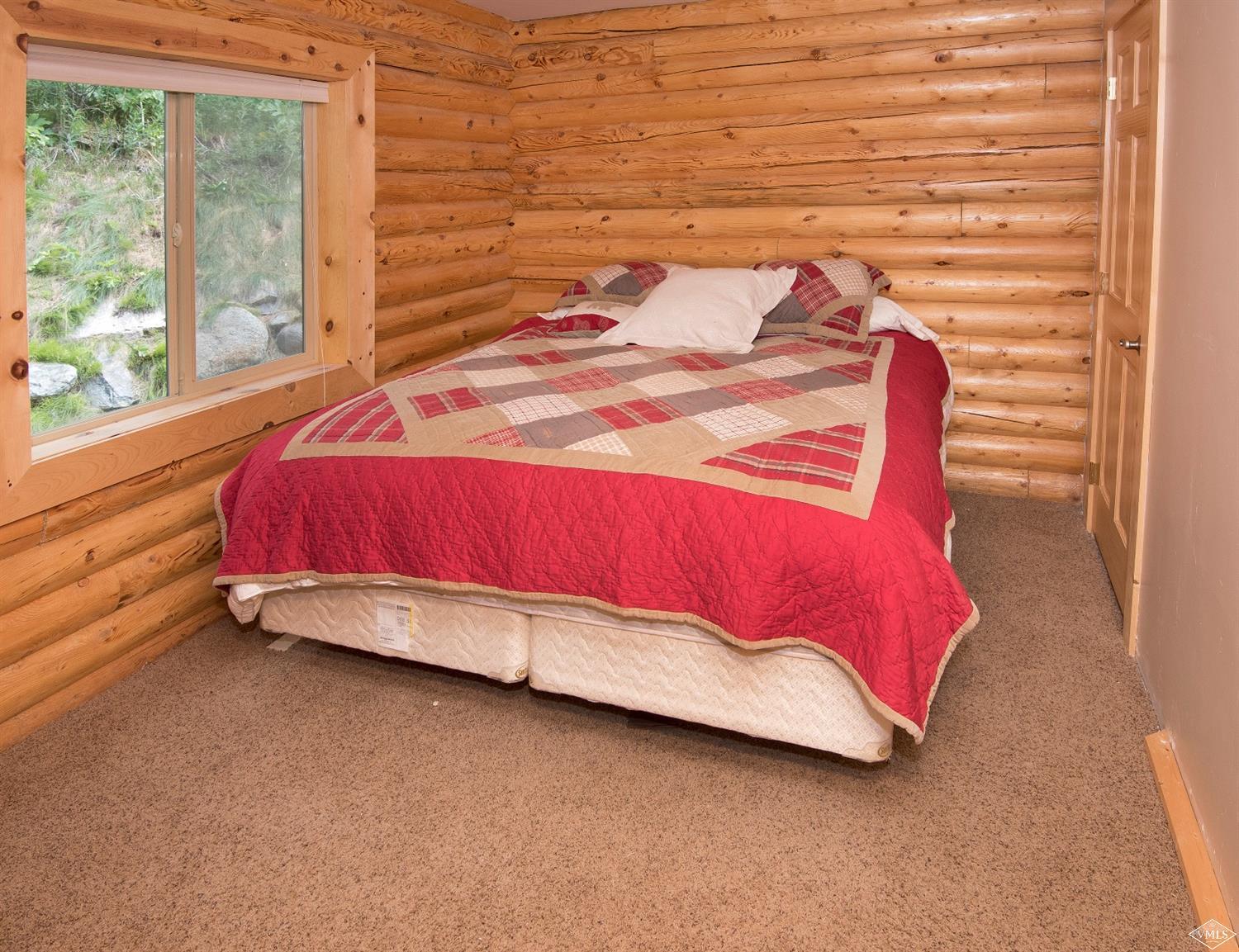 320 Mill Road Eagle, CO 81631 - Photo 12 of 24 a bedroom with a bed and a window